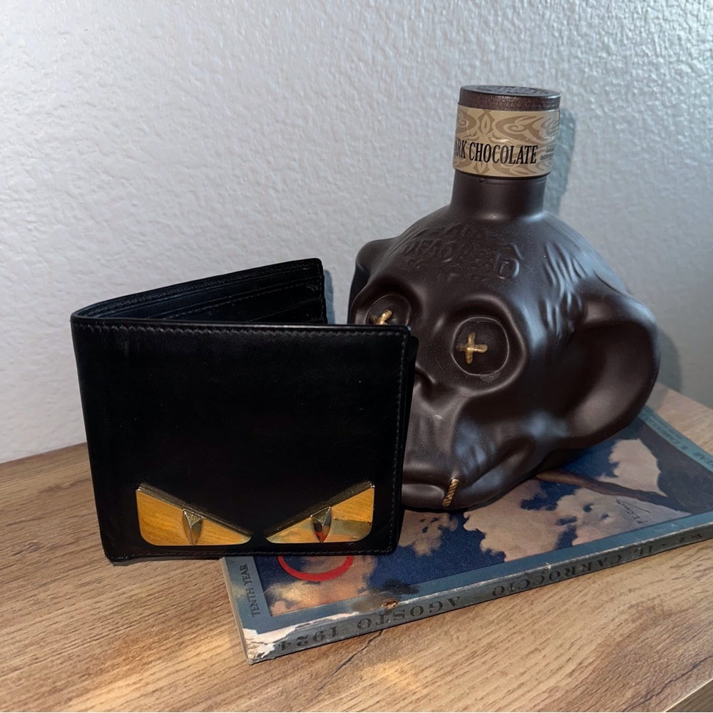 EUC Fendi “Monster Eyes” black leather with gold hardware wallet